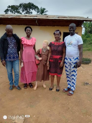 MW-volunteers-posing-with-the-principal-of-Ecole-Publique-de-Ndikinimeki
