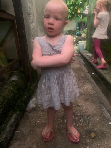 Little girl confidently posing for a photo